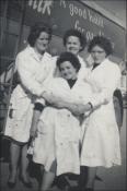 Mair, back centre, with co-workers, note the acid burns in the overalls